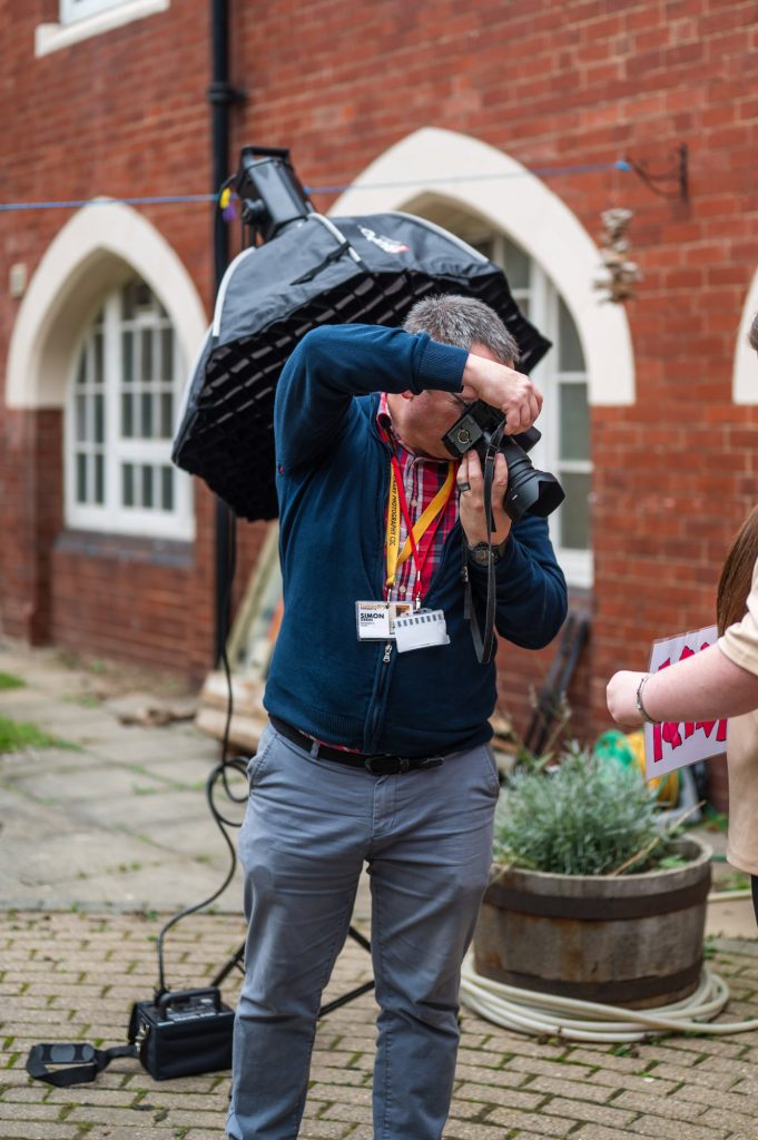 Photograph of a person taking photographs