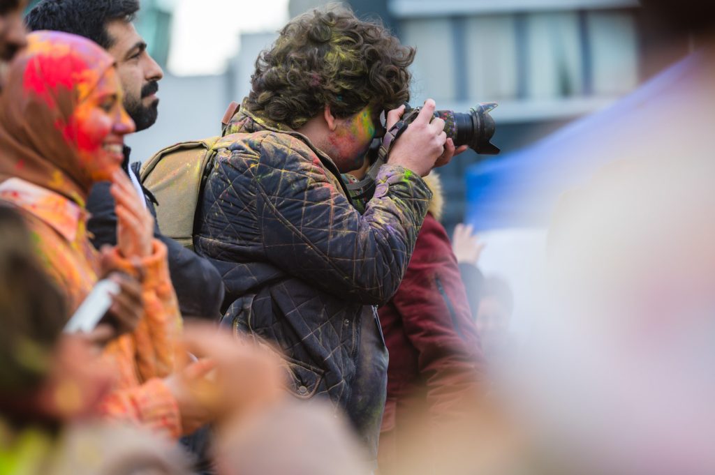 Young man taking photographs
